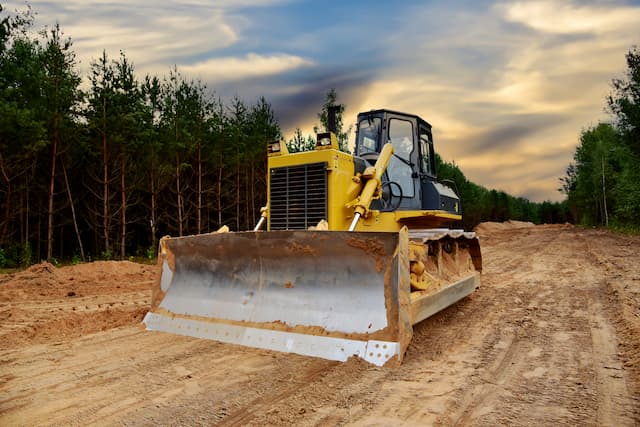 What equipment is best for clearing land