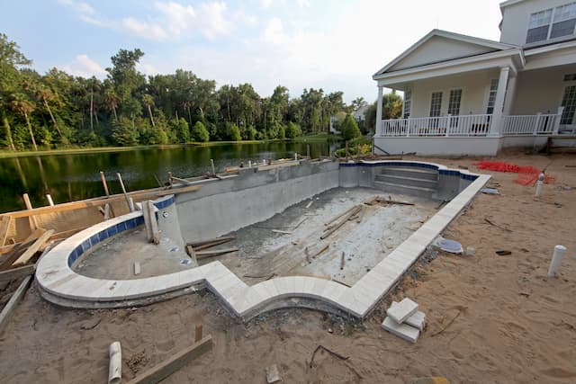 how to level ground for a swimming pool construction